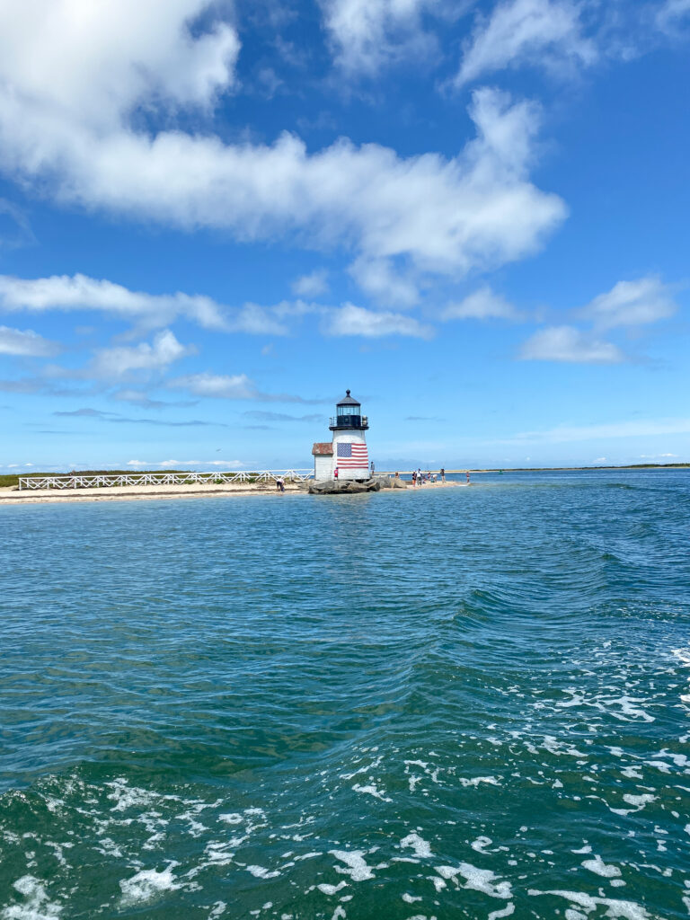 brant point light house view from a boat in the harbor nantucket photo diary