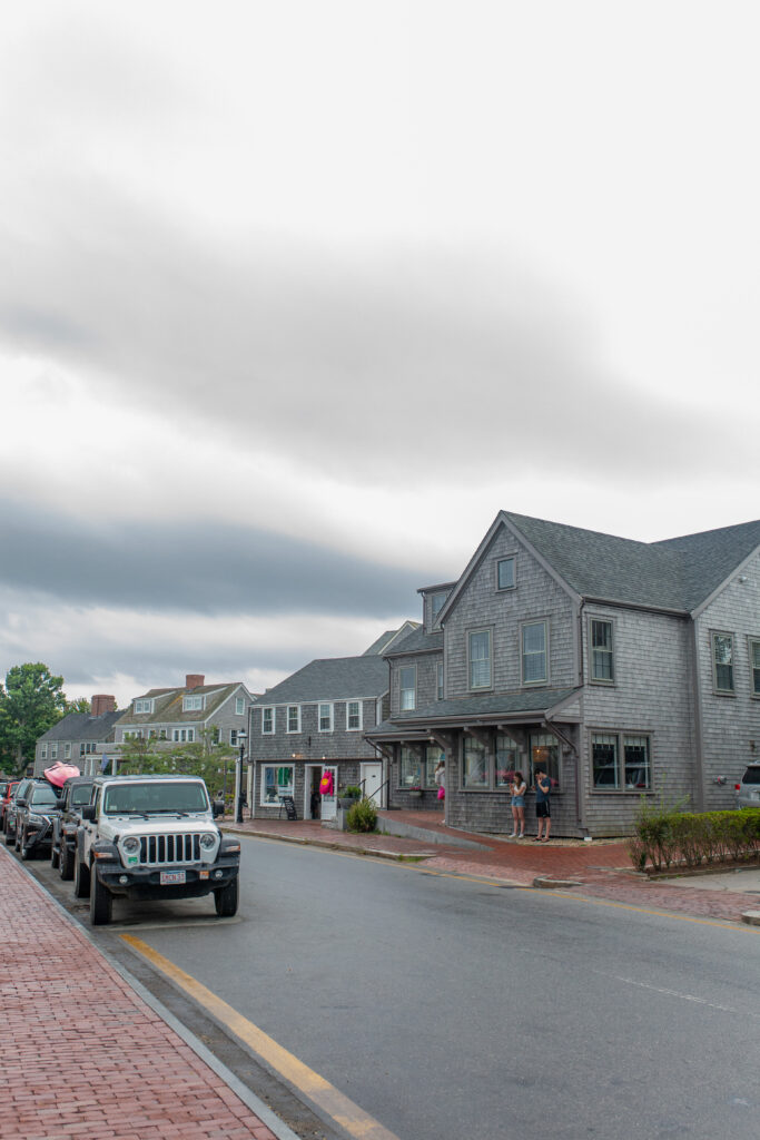 Nantucket photo diary street with grey houses and jeep parked