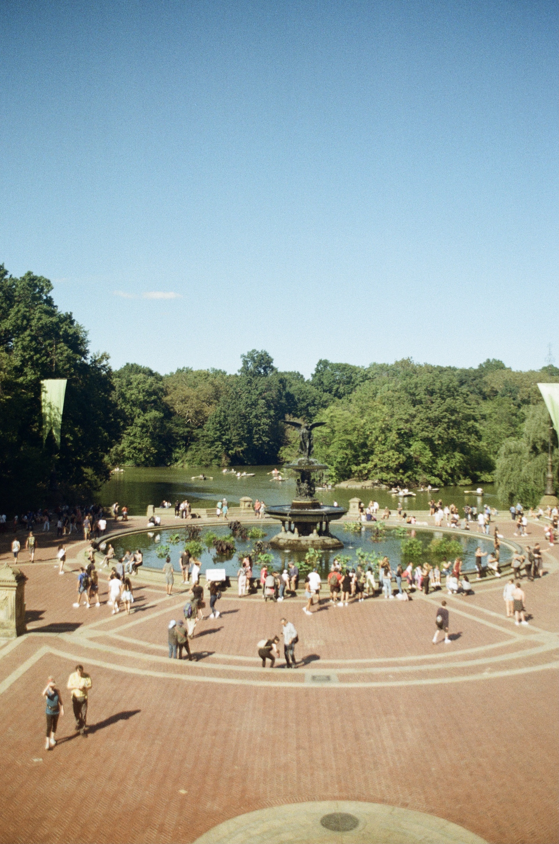people gathered around bethesda fountain in central park in new york city, shot on film